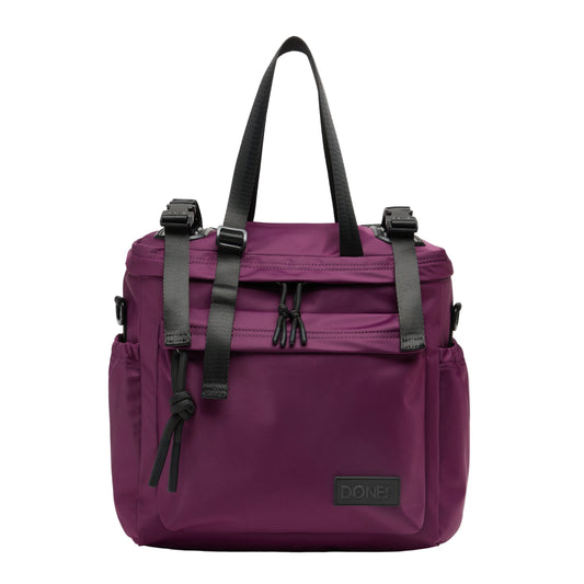 Purple bag with black straps on a light gray background