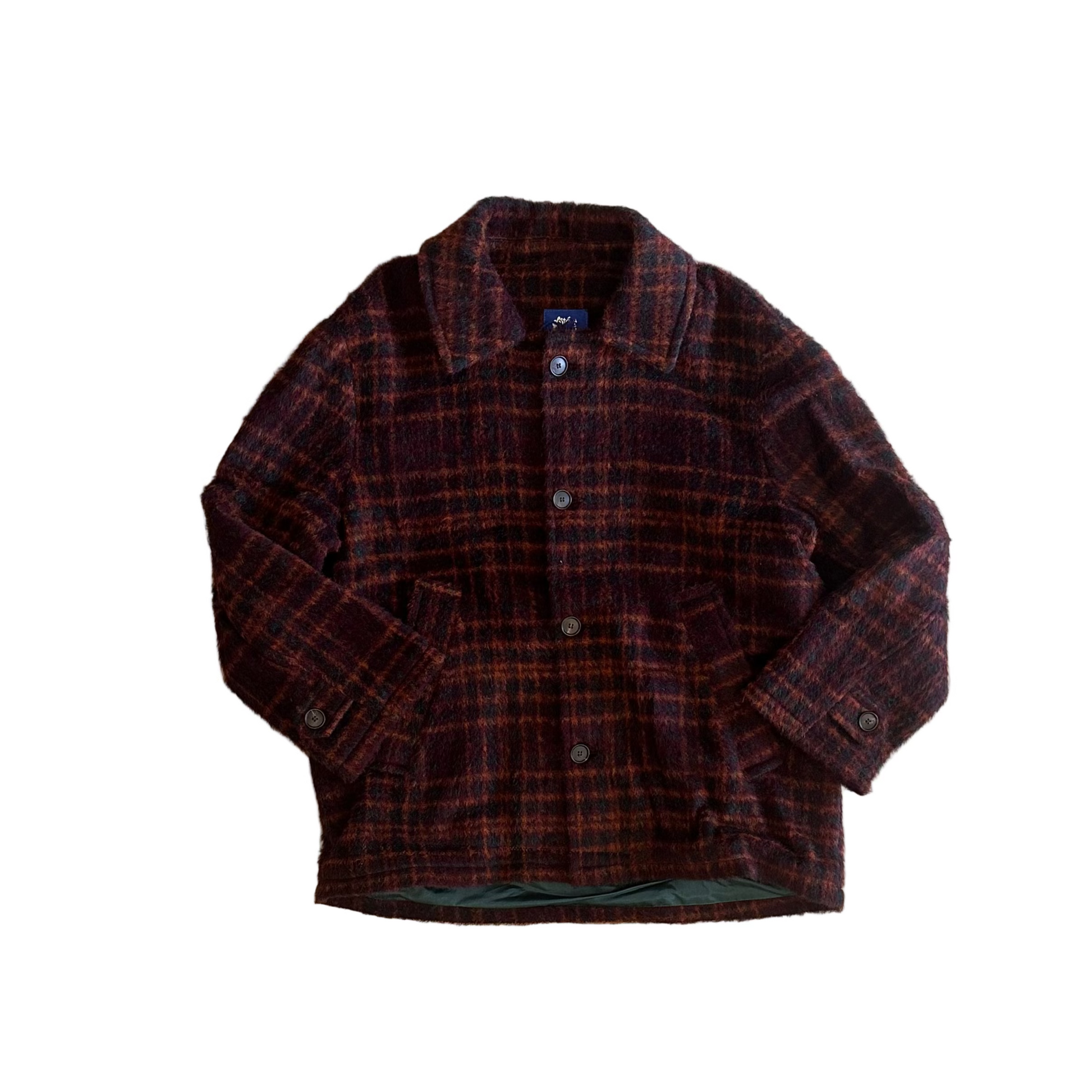 Brown plaid jacket on a wooden floor