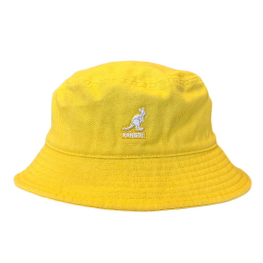 Yellow bucket hat on a counter in a store setting