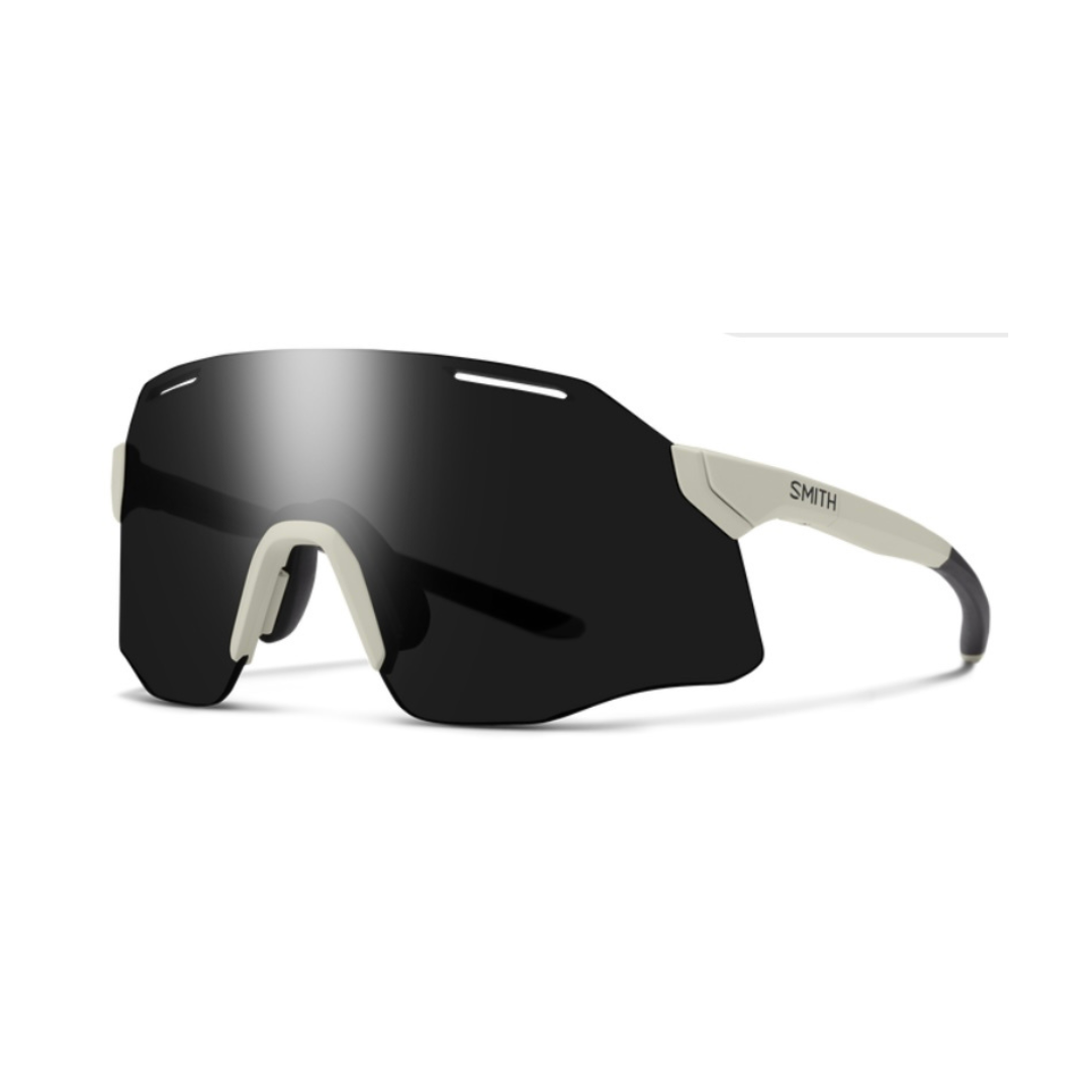 Sunglasses with black lenses and beige frame on a white background