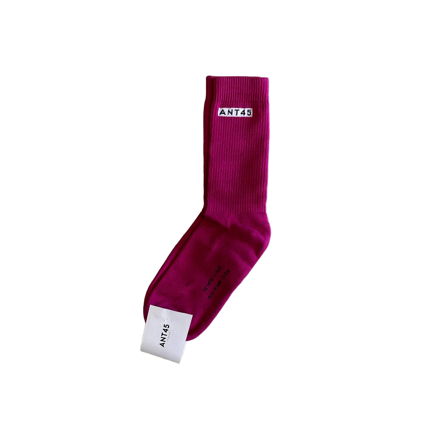 Maroon sock with a brand label on a wooden floor