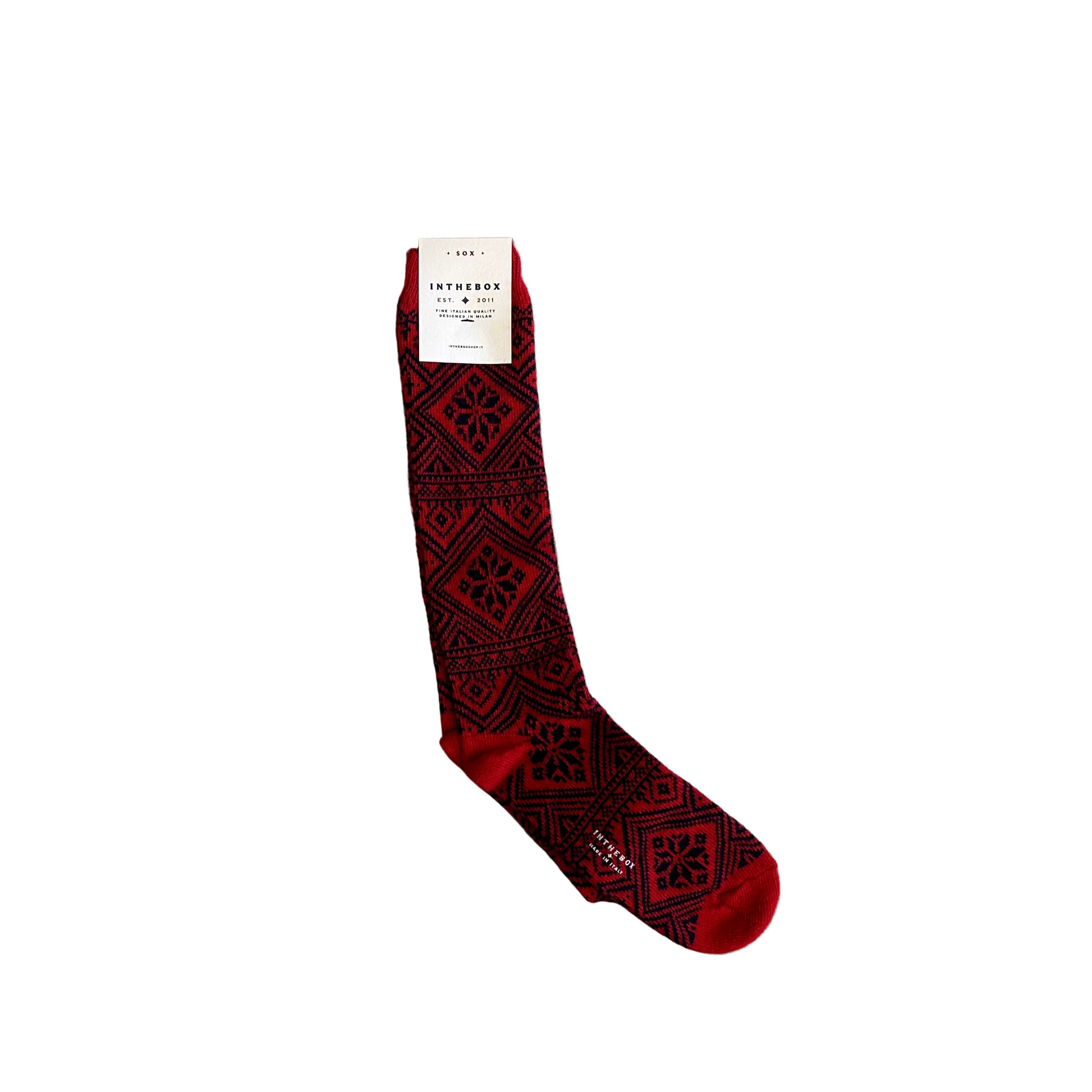 Red patterned sock on a wooden floor