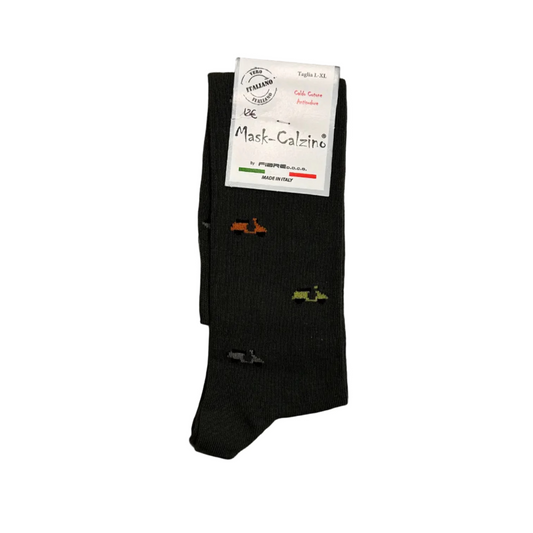 Black socks with colorful designs on a wooden floor, featuring a visible brand label.
