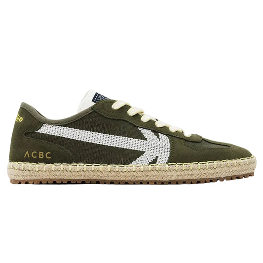 Green sneaker with white sole on a white background