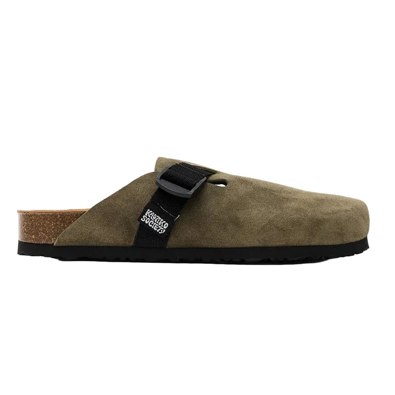 Brown suede clog shoe with a black strap on a white background